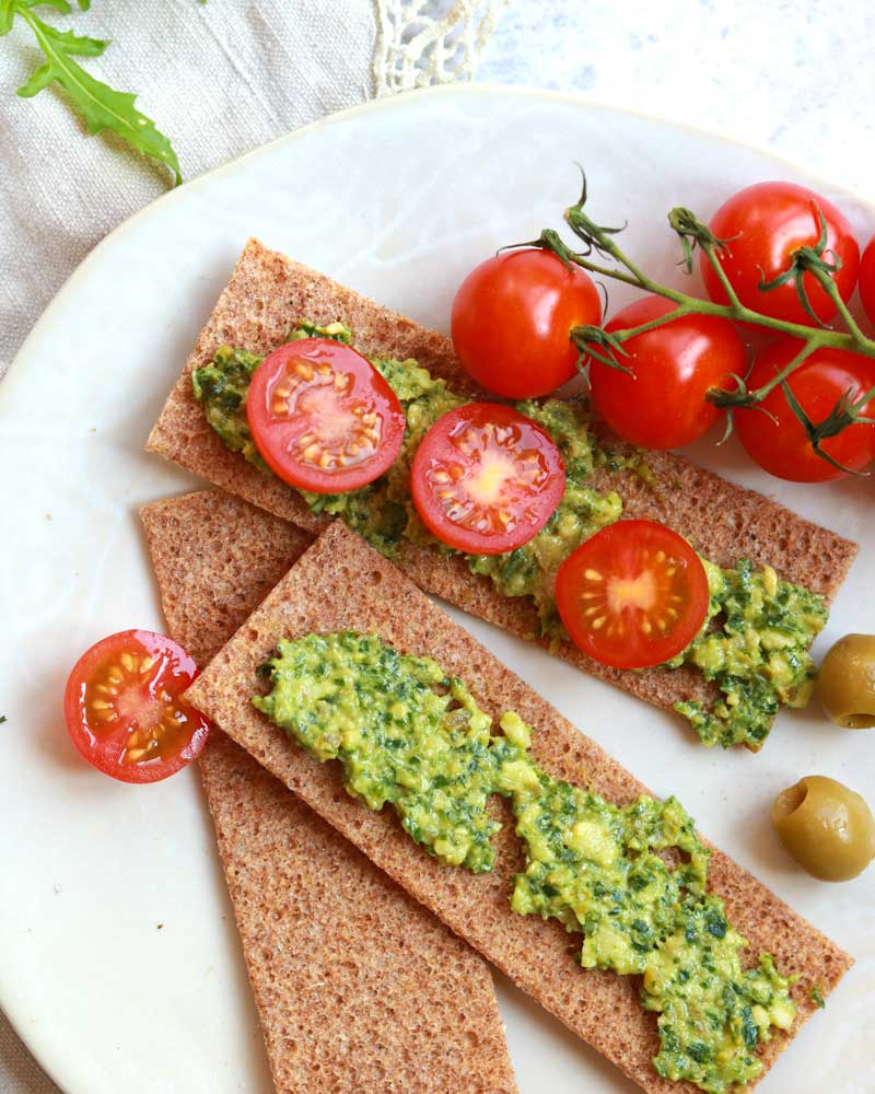 Chunky Rocket, Olive & Cashew Pesto dip on crackers