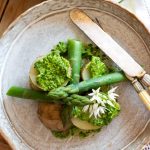 Asparagus, New Potatoes and Wild Garlic Pesto on a plate looking down.