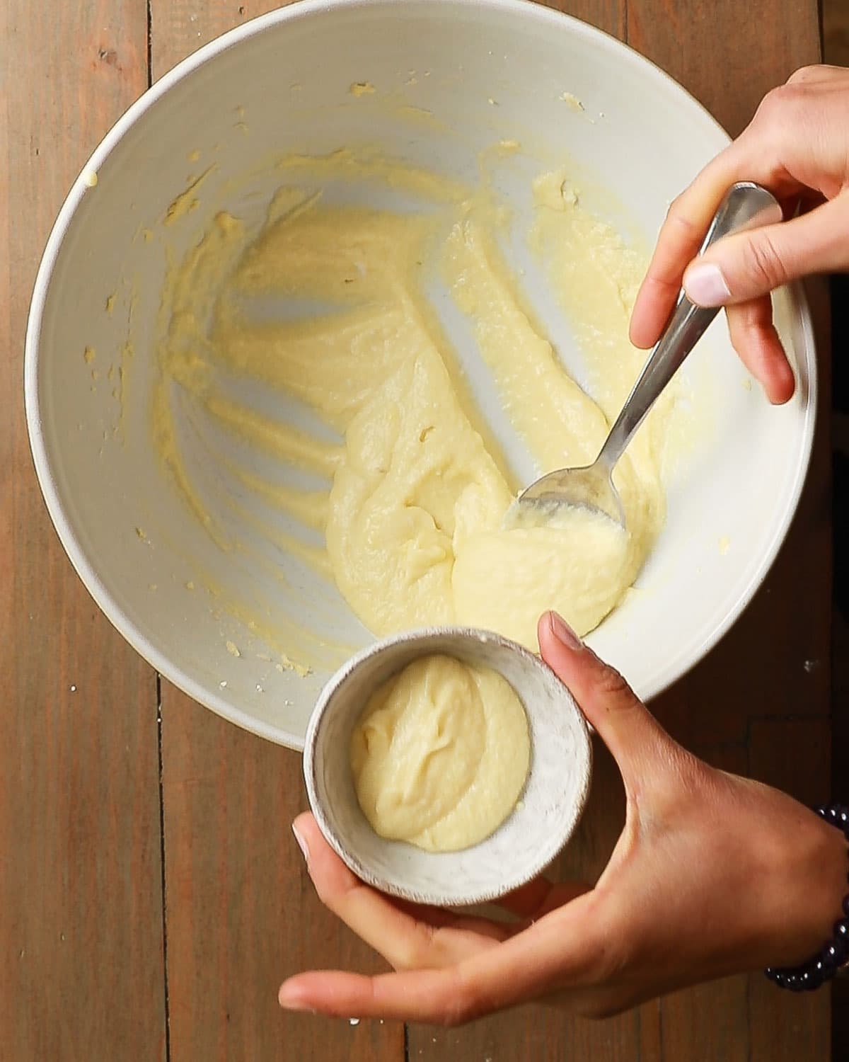 Spooning the vegan clotted cream in a small bowl.