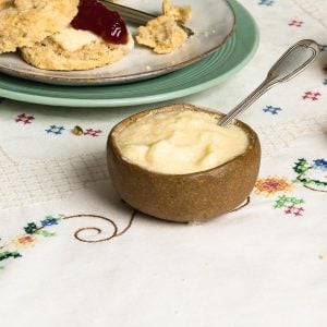 vegan clotted cream in a small bowl with a spoon.
