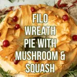The wreath pie on a platter with some rosemary around it.