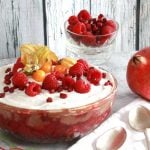 Chocolate Chestnut and Raspberry Trifle in a large glass dish with fruit in smaller dish in background