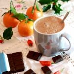 Energising Vegan Spiced Hot Chocolate with satsumas and chocolate squares to nibble on