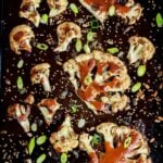 Roasted Cauliflower steaks with miso glaze on a tray.