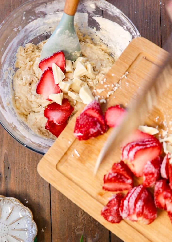 Image showing adding strawberries and chocolate to banana bread batter.