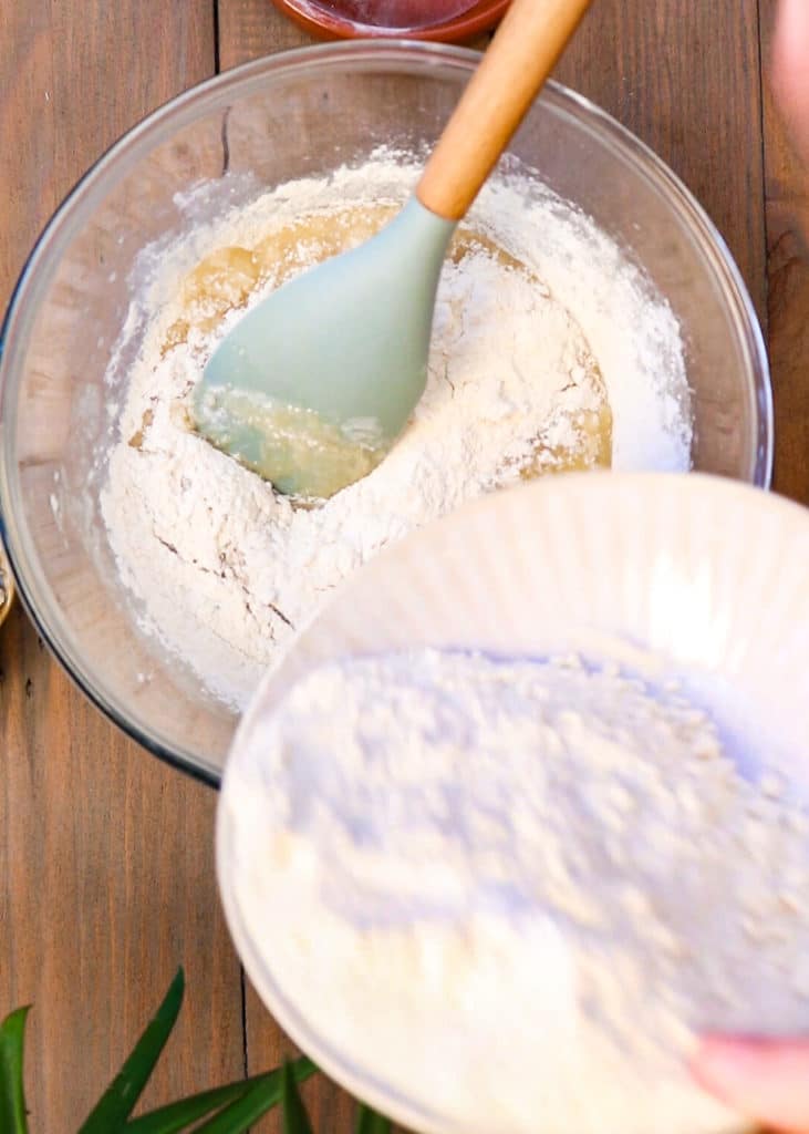 Image showing adding flour to the banana bread batter.