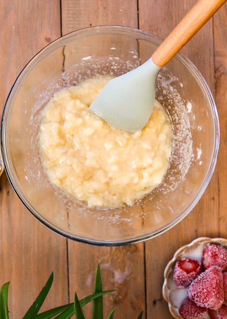 Image showing mixing the sugar into the banana bread batter.