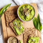 Wild Garlic Hummus in a bowl and on some crackers.