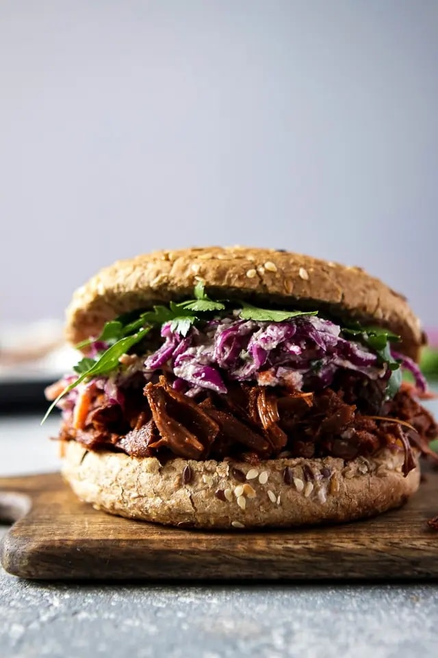 vegan pulled jackfruit in a bun with salad