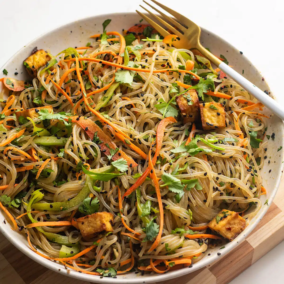 Tofu and Glass noodle salad with tahini chili crisp dressing.