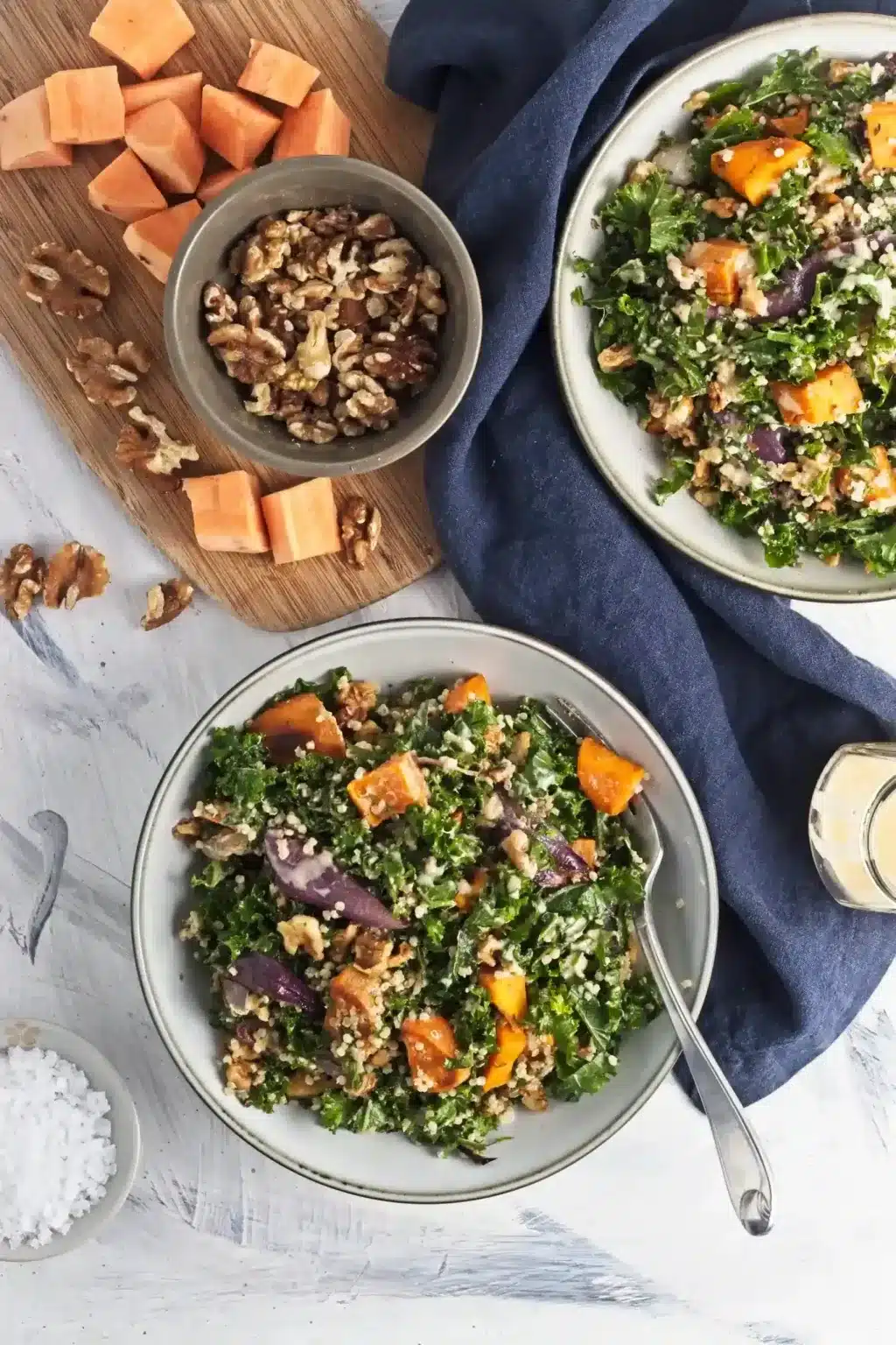 Bowls of sweet potato and kale salad ready to eat.