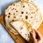 Roti being wrapped by a hand