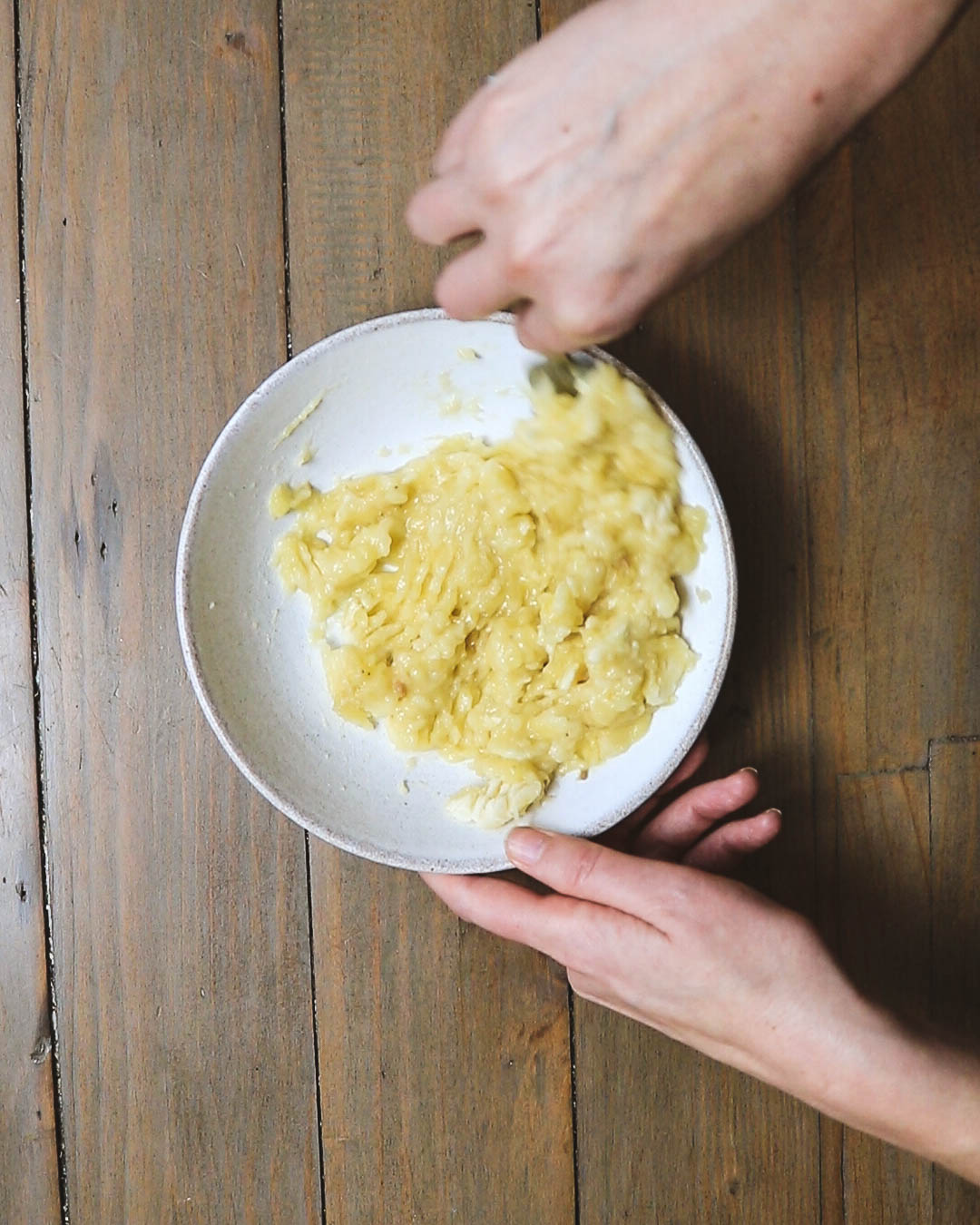 Showing the banana very well mashed up.