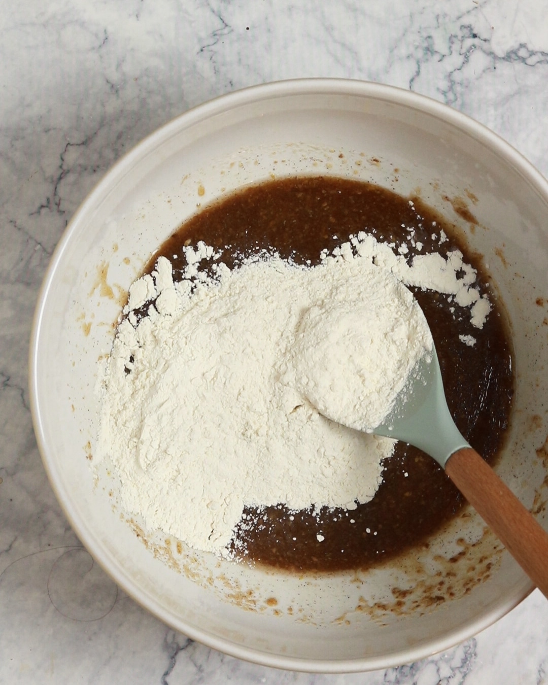 Adding the flour into the bowl