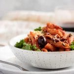 A bowl of vegan penne puttanesca