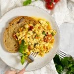 Tofu Scramble on a plate with a piece of toast.