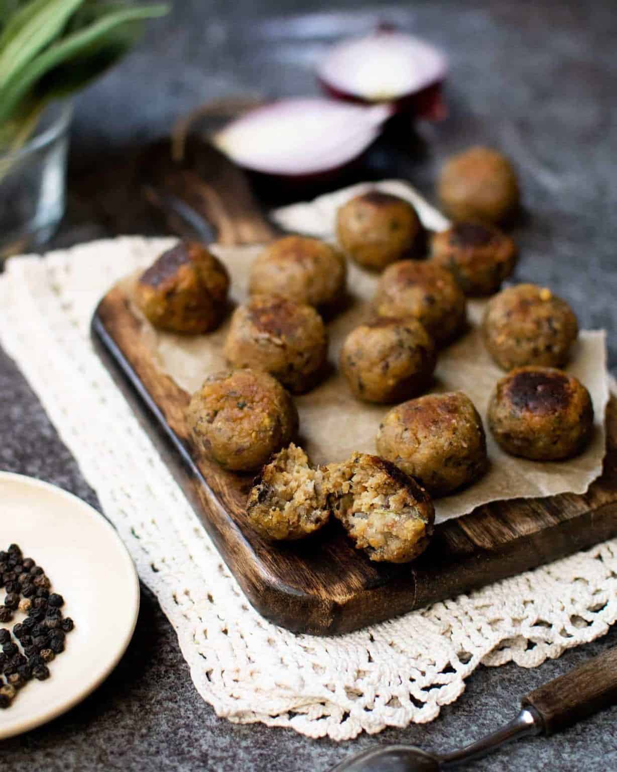 vegan stuffing balls on a wooden board.