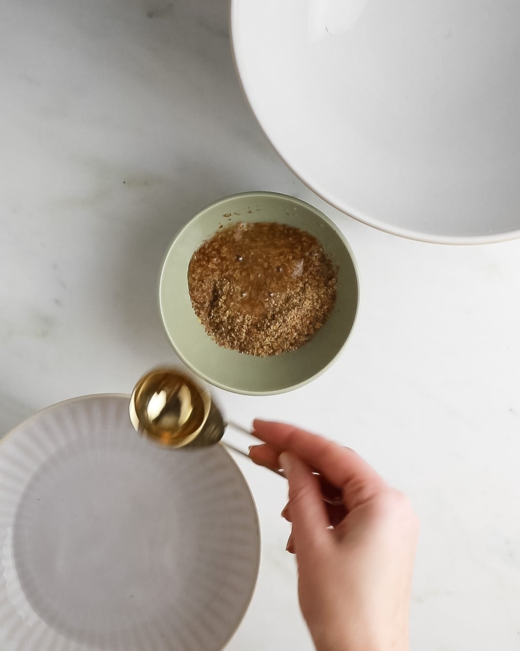 Mini bowl showing flaxseed being mixed with water to make cookies.