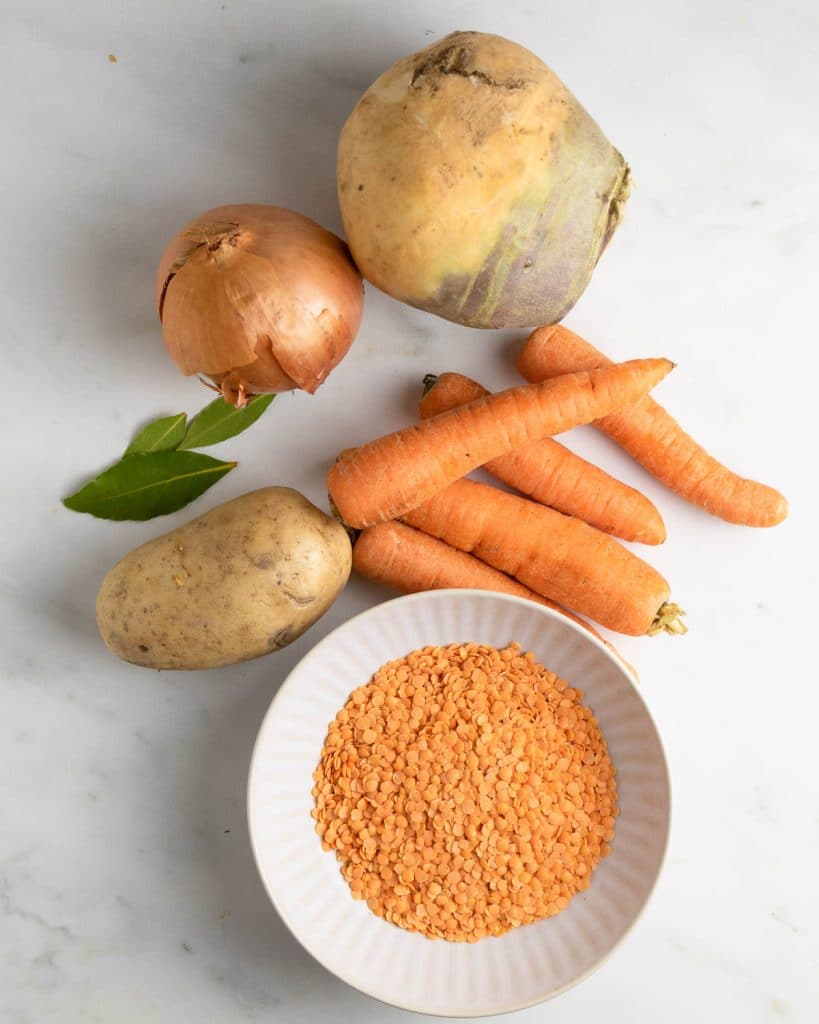 Image showing whole swede, carrot, potato and ready to chop finely.