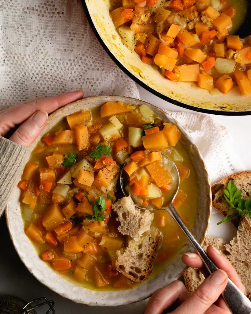 Adjust seasoning of the swede soup and serve with parsley.
