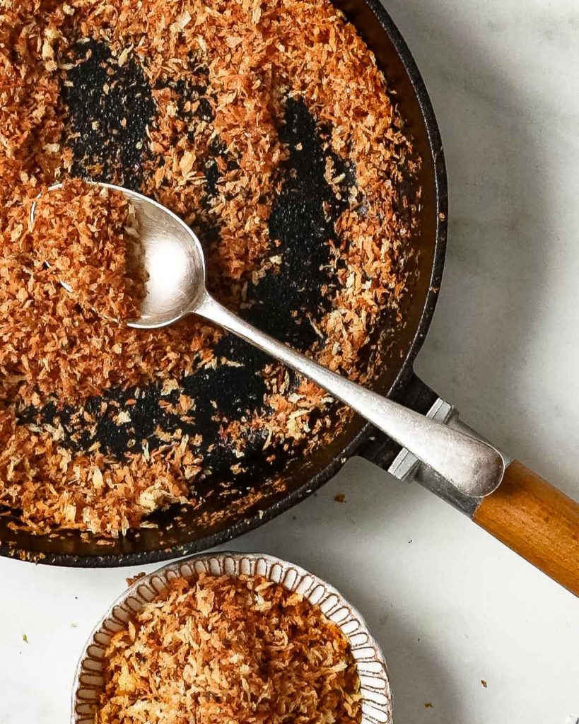 Showing the final pan of breadcrumbs, now toasted and golden.