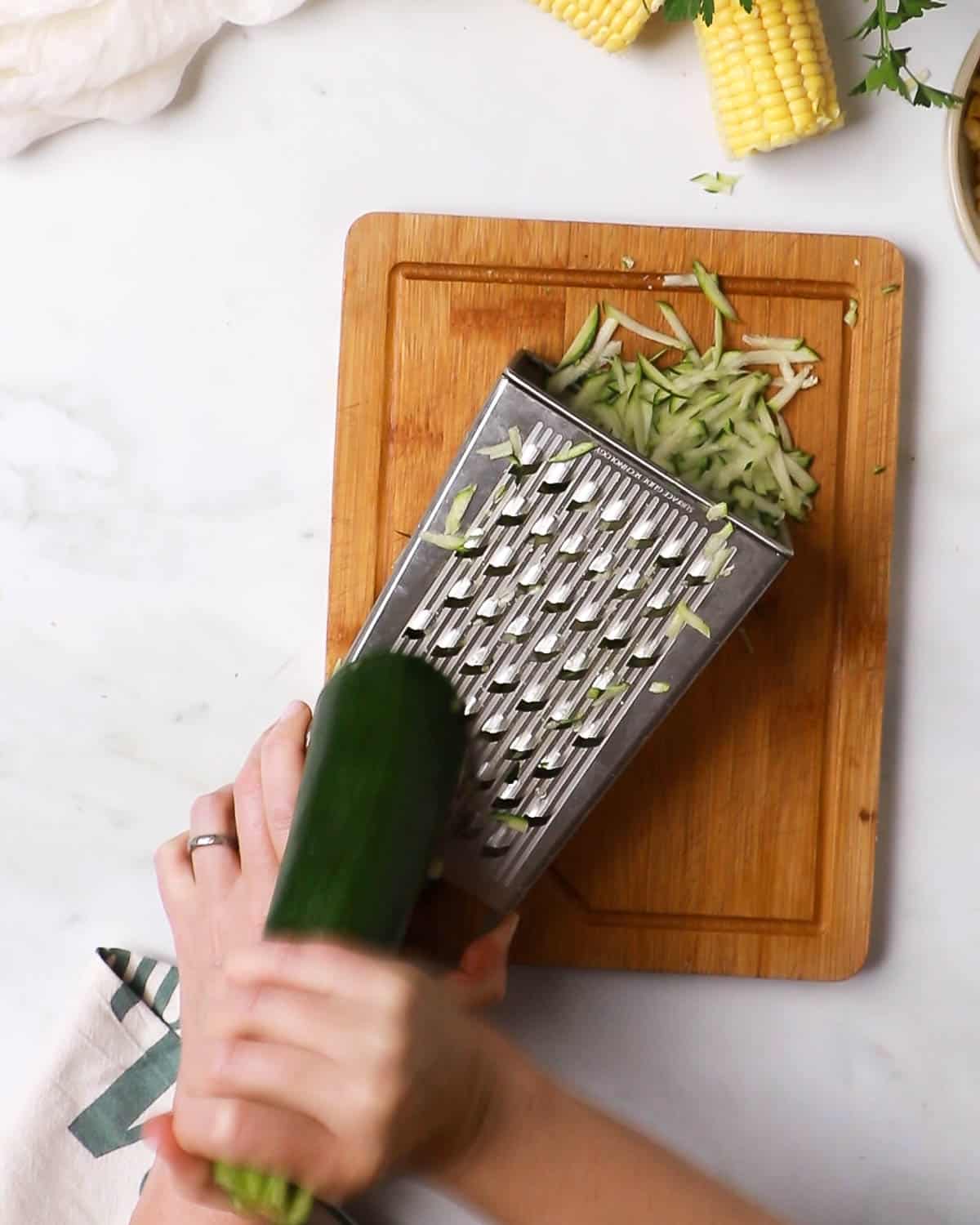 Grating the courgette (zucchini) for the fritters)