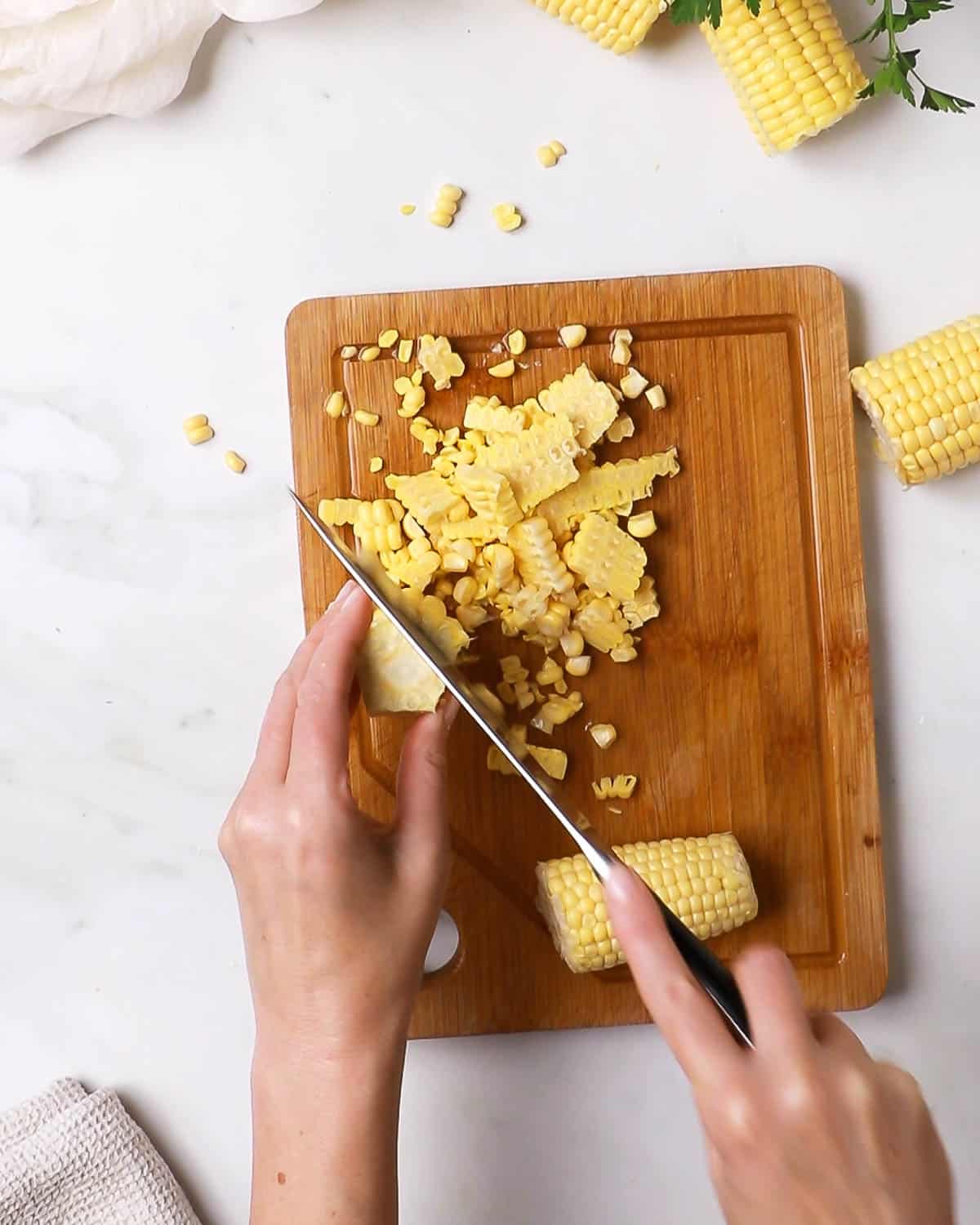 Sweet Corn being cut from the cob. Ready to make fritters with!.