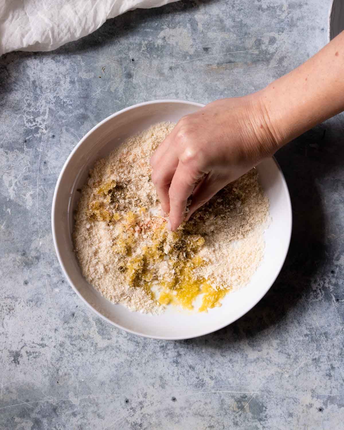 Mix up the panko and seasonings, scrunching in the oil to coat the panko breadcrumbs evenly.