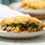 Vegan mushroom lasagne with kale on a plate ready to eat.