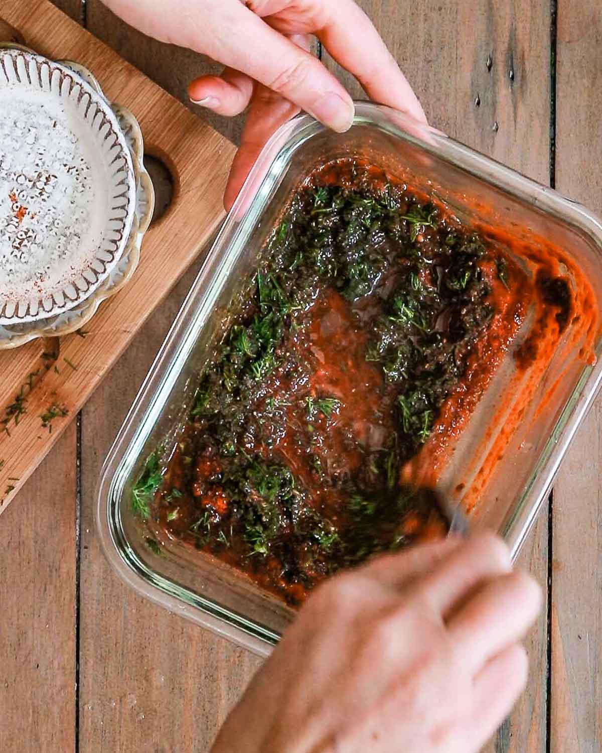 Mixing up the marinade and adding the carrots to it. 