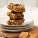A stack of biscoff flapjacks on a plate ready to eat.