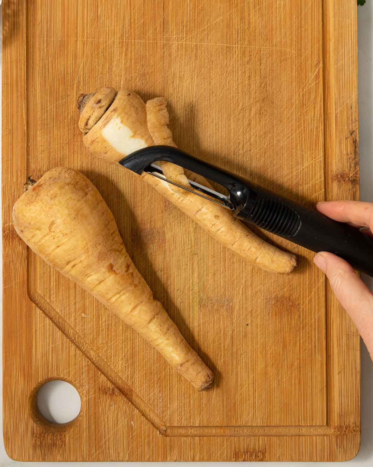 Parsnips being peeled.