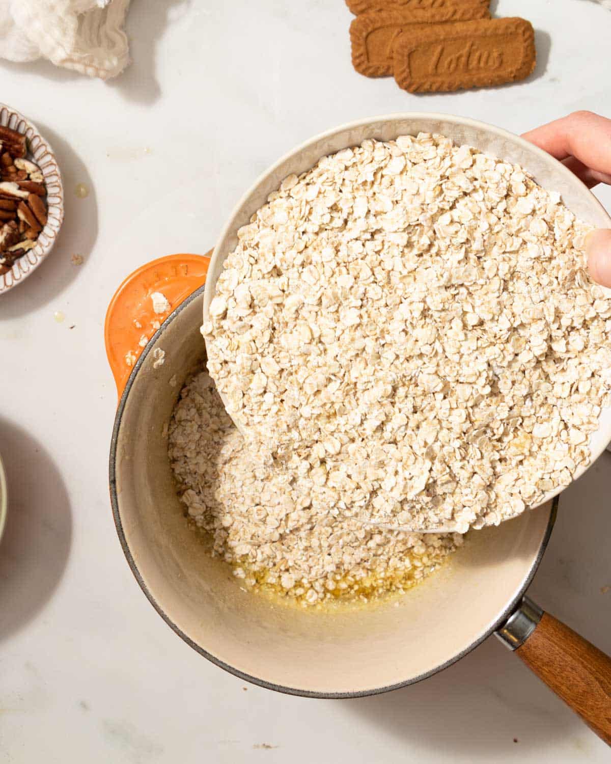 Add the oats and biscoff to the butter.
