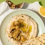 Butterbean hummus in a bowl with some olive oil and za'atar on top.