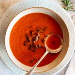 Tomato soup with black beans in a bowl ready to eat.