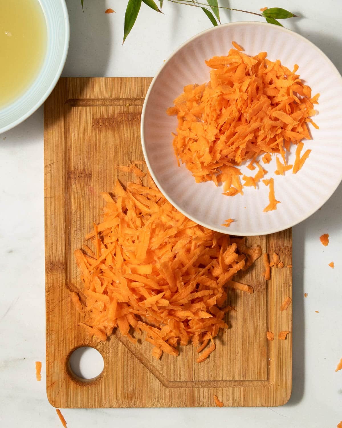 Grate the carrots and weigh or measure them.