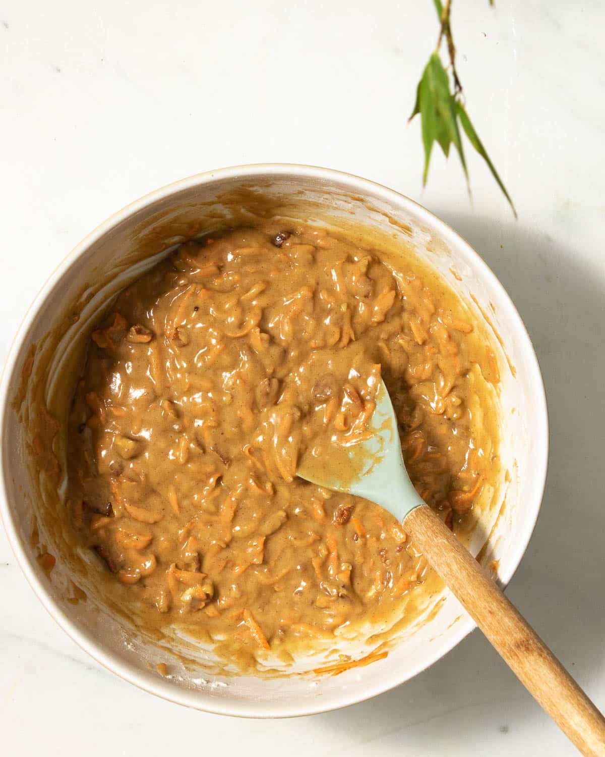 Add in the carrots and chopped nuts if using. Pour into baking trays.