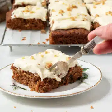 A piece of vegan carrot cake with a fork.