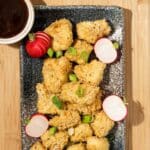 Air fried tofu nuggets ready to eat on a plate.