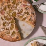 Rhubarb cake with a slice taken out of it.