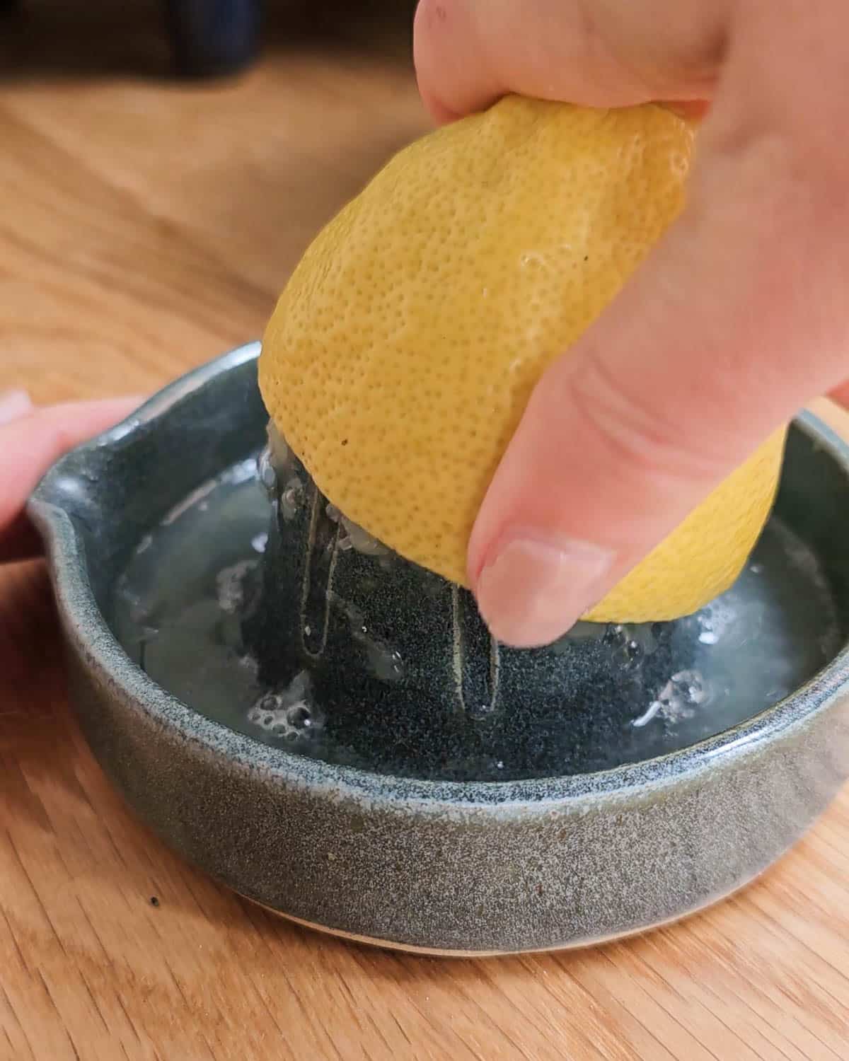 Squeezing lemon juice.