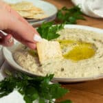 A plate of babaganoush being eaten.