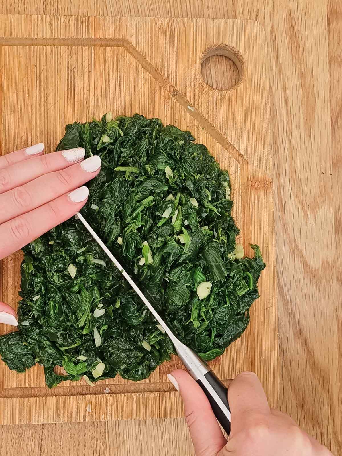 Chopping the spinach.