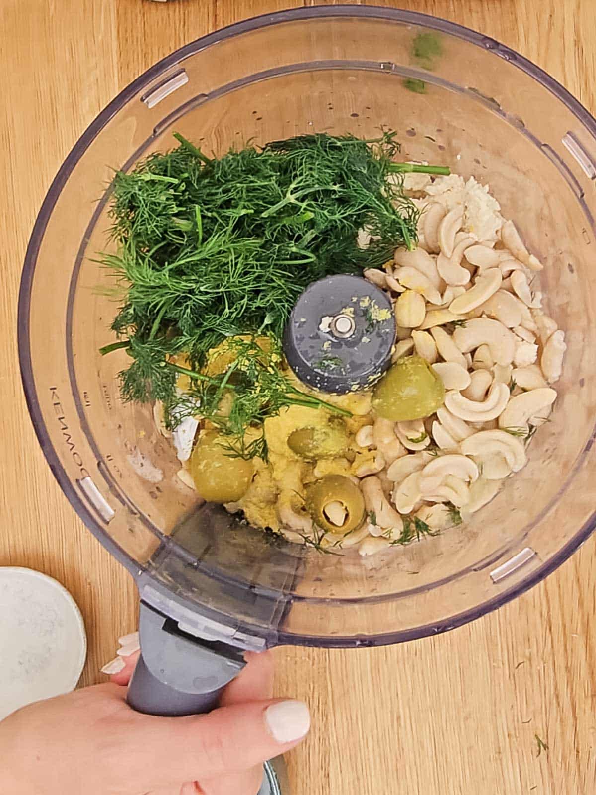 Ingredients for the cheese mixture in a food processor.