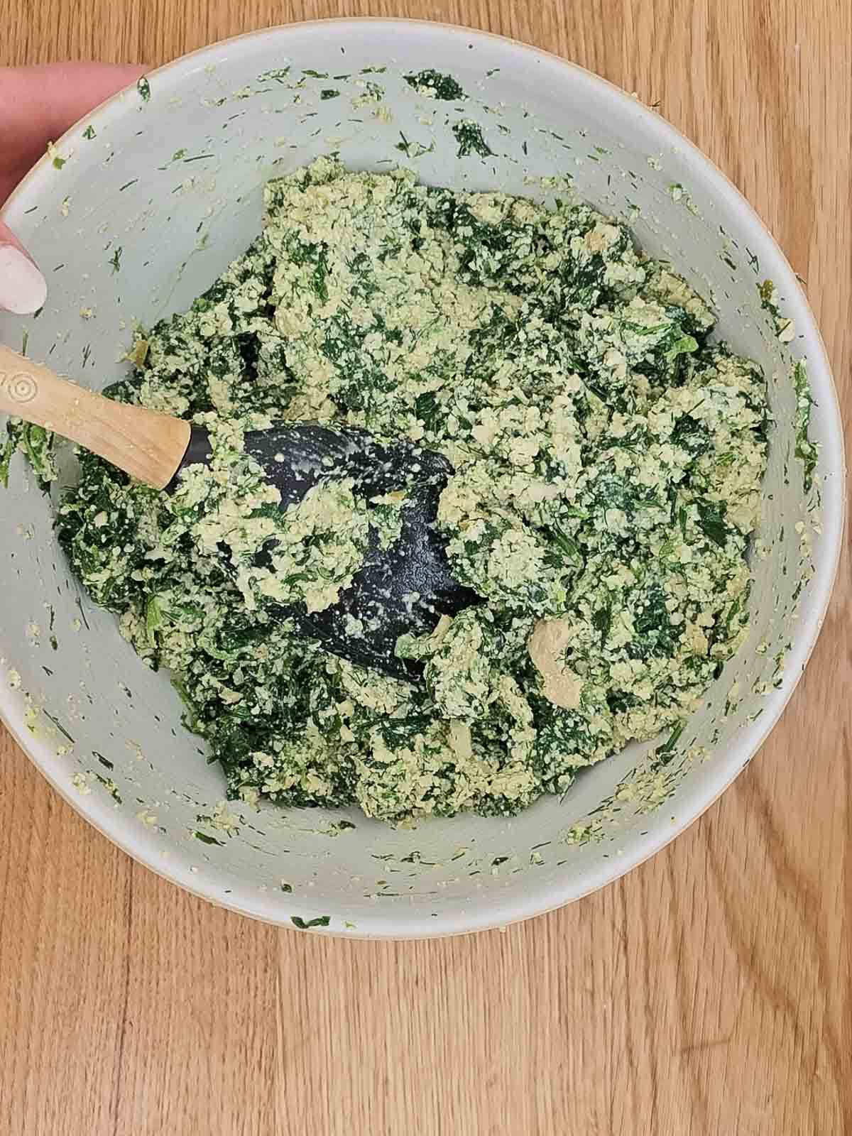 Folding in the cheese.