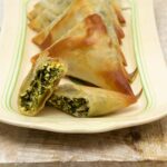 Vegan Spanakopita Triangles ready to eat.
