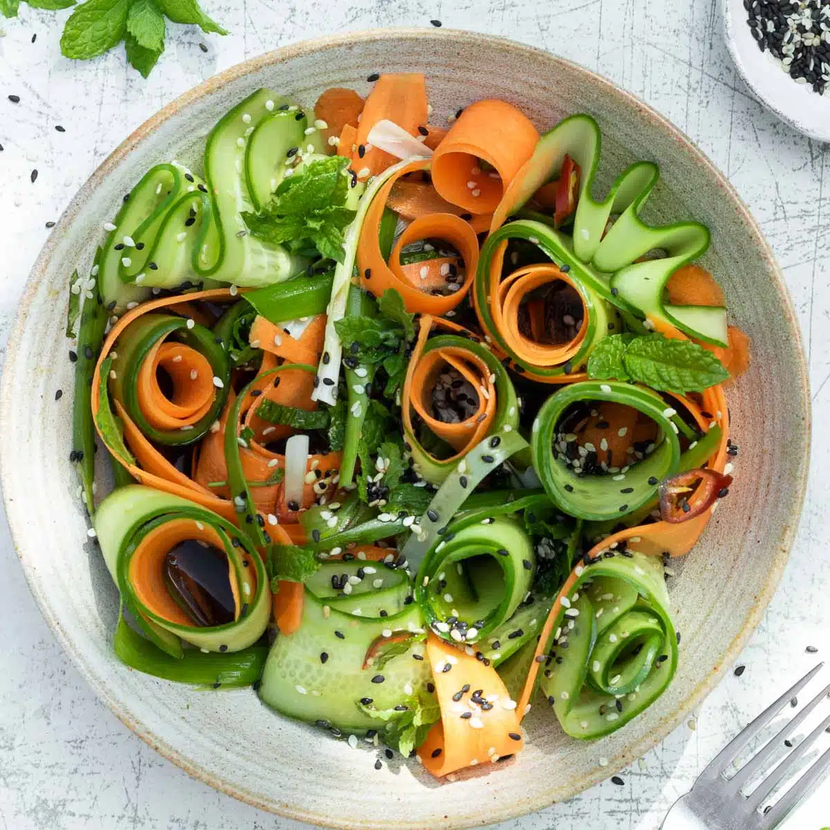 Carrot and cucumber salad ready to eat in a bowl.