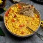 A bowl of corn chowder with golden beetroot and cauliflower ready to eat.