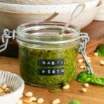 A jar of basil pesto ready to use.