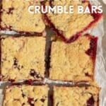 Vegan cranberry shortbread bars, with one being held up to the camera to show the juicy cranberry interior.